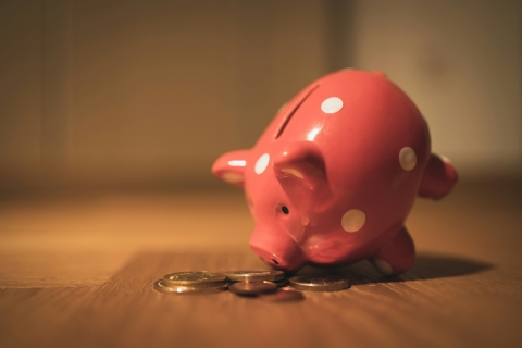Pink piggybank on its side